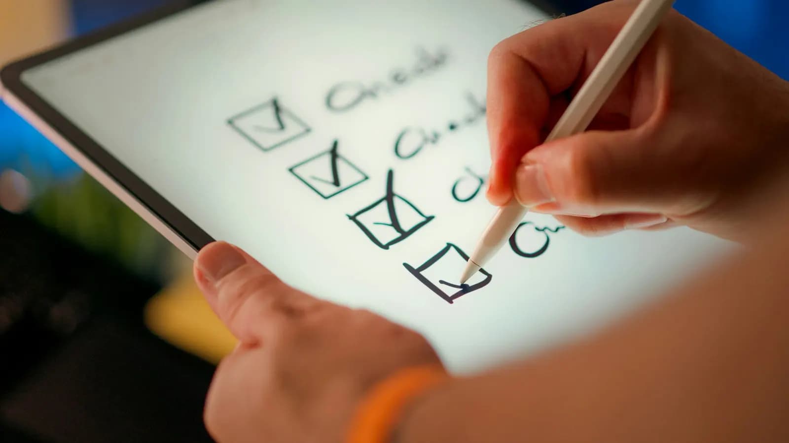 Checklist being ticked off on a tablet during onboarding