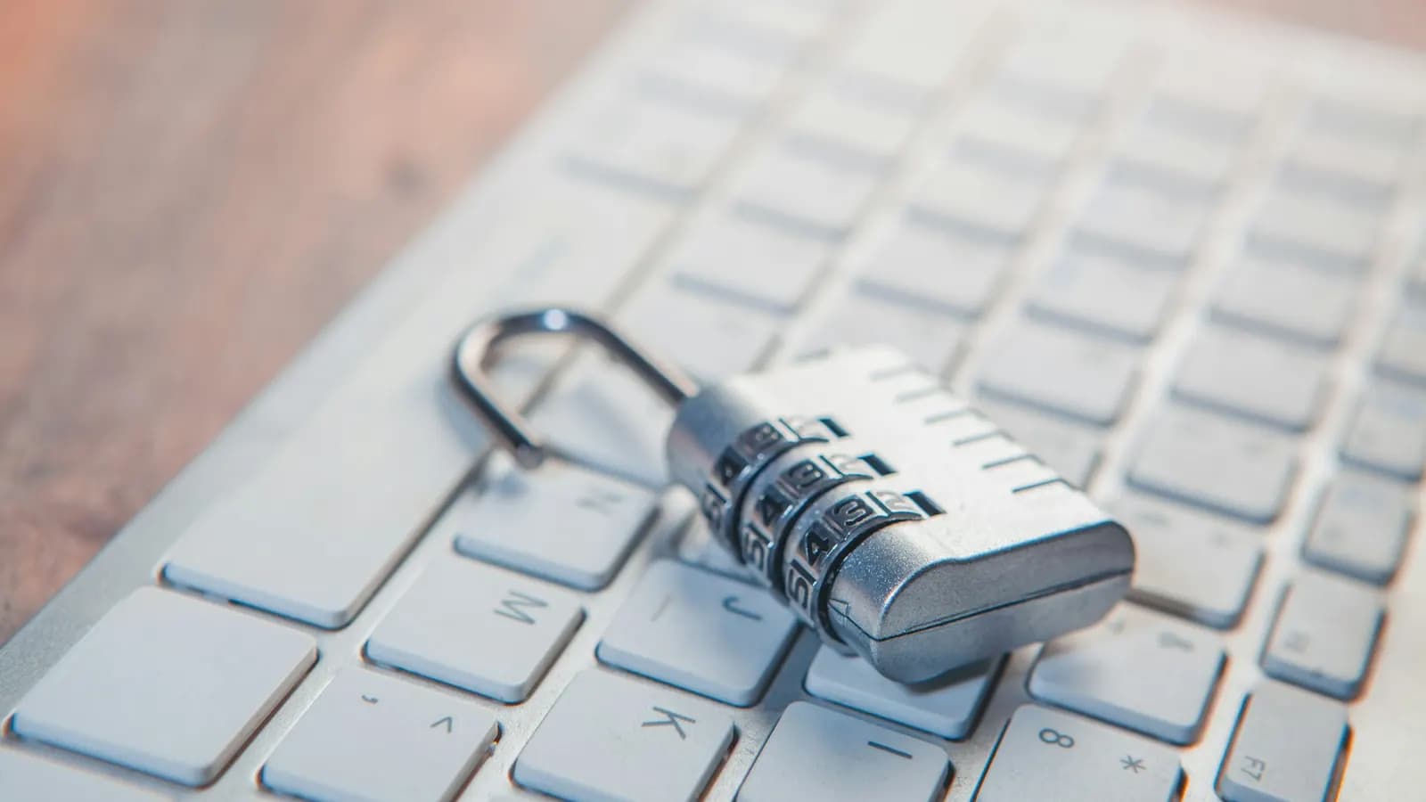 Padlock resting on a keyboard, representing Google Workspace account and data security